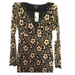 Brand new beautiful black overlay on gold lace.